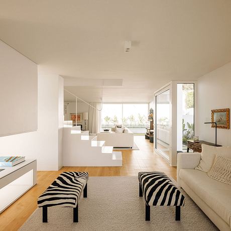 A modern, open-concept living space with clean lines, natural materials, and sculptural stairs.