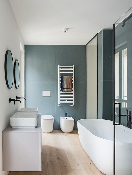 Sleek minimalist bathroom with modern fixtures, muted color scheme, and elegant design.