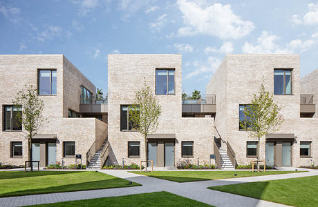 Architecturally-designed multi-unit apartment complex with uniform brick facade and landscaping.