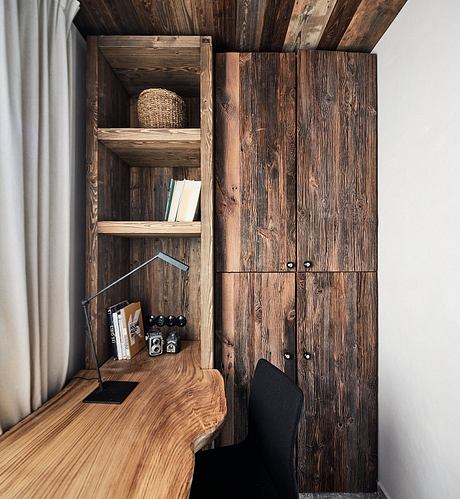 Rustic wooden shelves and cabinets in a cozy, minimalist interior design.