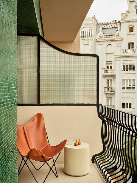 Cozy balcony with minimalist furniture, architectural details, and vibrant colors.