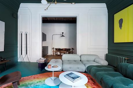 Eclectic modern interior with vibrant colors, comfortable seating, and architectural details.