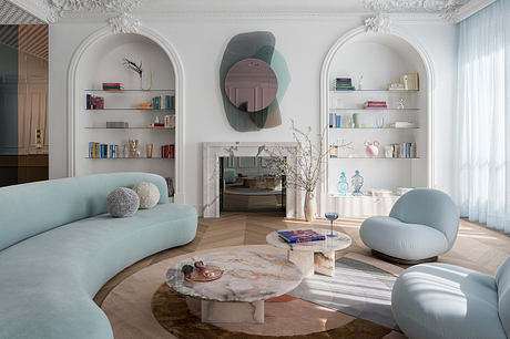 Luxurious living room with ornate moldings, arched shelves, and marble coffee tables.
