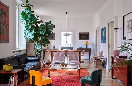 Vibrant, eclectic living space with mix of modern and vintage furnishings and decor.