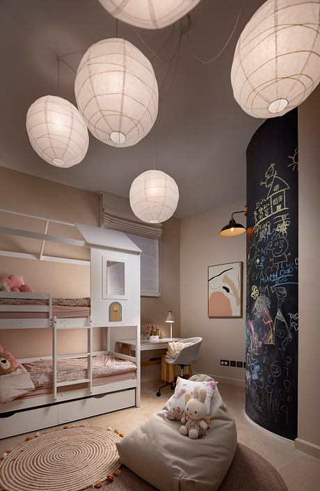 Cozy bedroom with bunk beds, white lanterns, and a chalkboard wall displaying playful artwork.