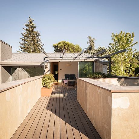 Expansive outdoor deck with integrated landscaping and modern architectural details.