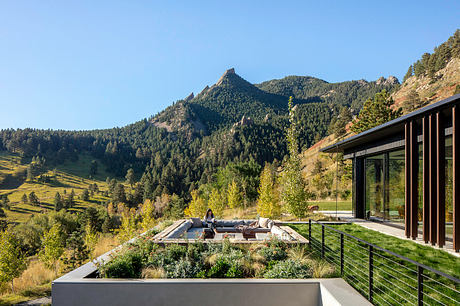Stunning mountain vista seen from modern rustic home with spacious outdoor living area.