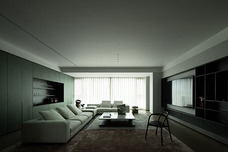 Sleek modern living room with minimalist furniture, large windows, and built-in cabinetry.