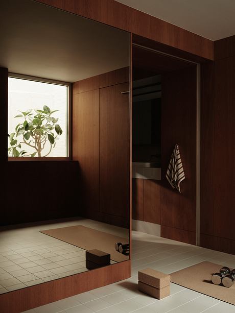 A warm-toned, minimalist bathroom with wooden paneled walls, a large window, and modern fixtures.