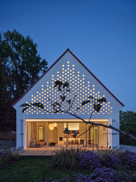 Striking modern home with creative lighting pattern and cozy interior.