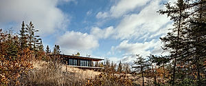 Burnt Rock: Olson Kundig Cabin Cantilevers Over Remote Minnesota Meadow