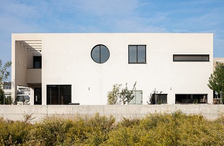 House with Double-Height Living Room by Ronnie Friedman