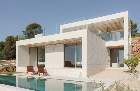 Stepped House Opens Up to Views Across Iberian Hills Around Swimming Pool
