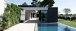 House in Misano Adriatico Pairs Warm Wood With Cool Stone Surfaces