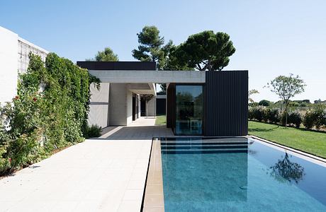 House in Misano Adriatico Pairs Warm Wood With Cool Stone Surfaces