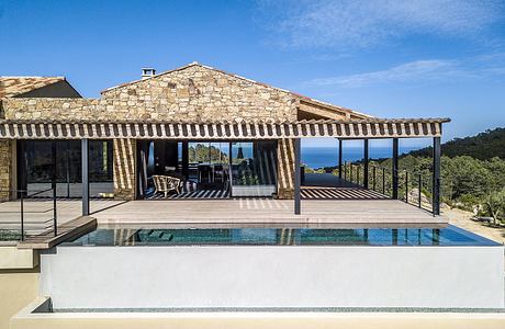 Maison TO Anchors a Mountain-to-Sea Retreat with Local Stone in Corsica