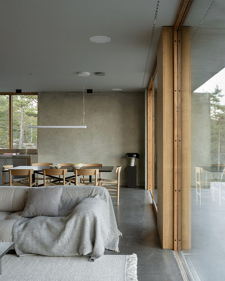 House Djurö Refines Indoor–Outdoor Living with Concrete Terrace - 2