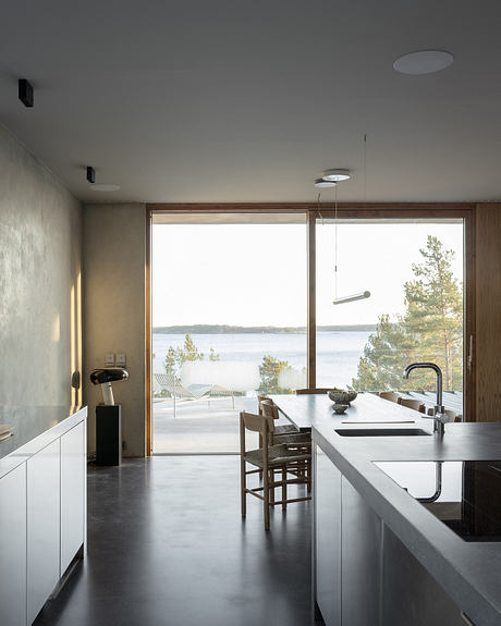 House Djurö Refines Indoor–Outdoor Living with Concrete Terrace - 3