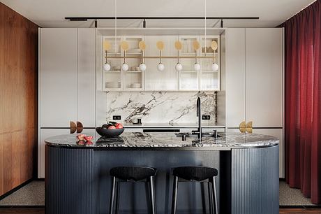 KSS Apartment Frames Warm Modern Interiors with Marble and Velvet - 3