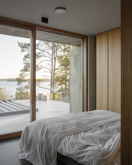 House Djurö Refines Indoor–Outdoor Living with Concrete Terrace - 6