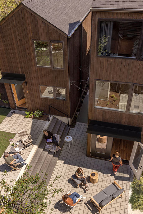 Corvidae Co-op — Gabled Units, Generous Windows, Everyday Community - 9
