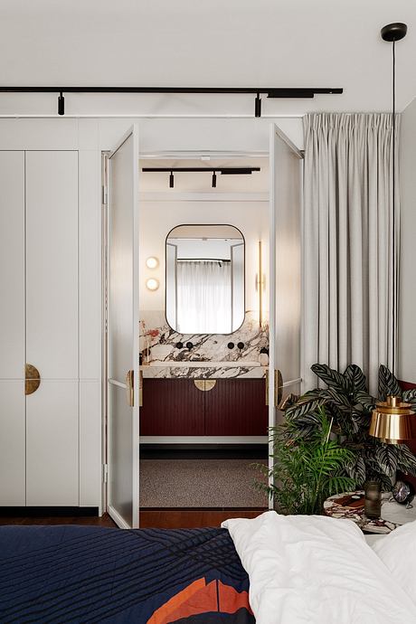 KSS Apartment Frames Warm Modern Interiors with Marble and Velvet - 9