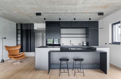 Marina Nova Refines Industrial Calm in a Riverfront Prague Apartment