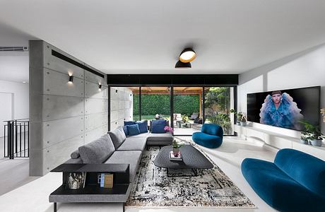 Concrete Harmony House Balances Cool Minimalism With Vivid Comfort