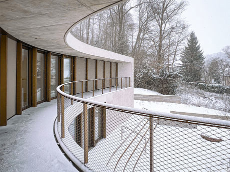 Winkelhaus — Curved Family Home Rooted in Swiss Hillside Landscape - 5