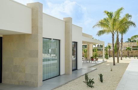 House P02: Mediterranean Villa Framed By Stone, Light, and Water Lines