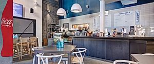 J Street Hospitality Office: Crafted Workplace Over Larry’s Deli Hub