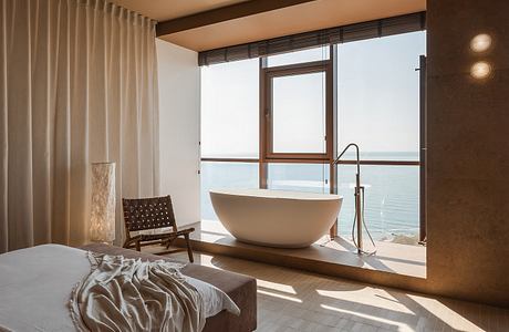 Limestone Project Uses Earth Tones to Shape Quiet Guest Rooms Inside