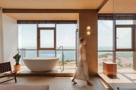 Limestone Project Uses Earth Tones to Shape Quiet Guest Rooms Inside - 4