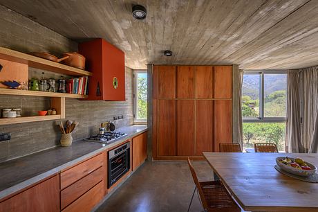 Casa Cosmos: Rammed Stone and Exposed Concrete on a Sloped Site Edge - 5