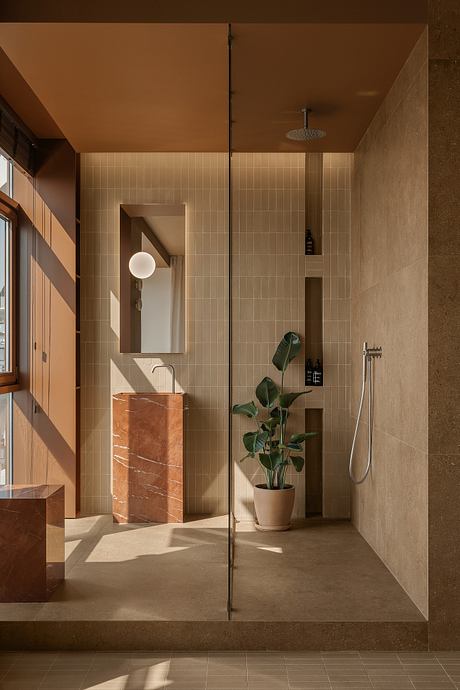 Limestone Project Uses Earth Tones to Shape Quiet Guest Rooms Inside - 5