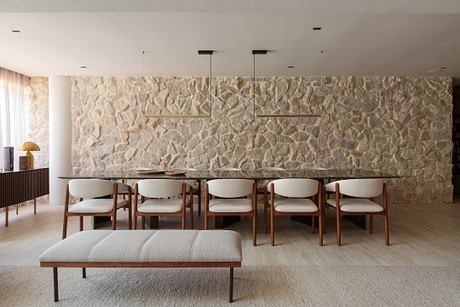 Cerâmica Apartment Shapes Calm Interiors Through Warm Stone and Wood - 5