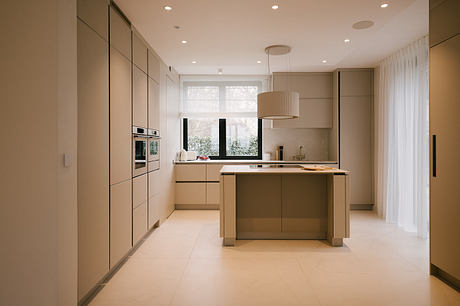 Pigwy Residence Shapes a Quiet Domestic Mood Through Marble and Oak - 3