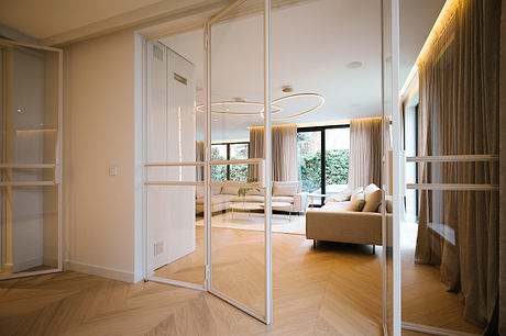 Pigwy Residence Shapes a Quiet Domestic Mood Through Marble and Oak - 4