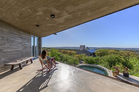 Casa Cosmos: Rammed Stone and Exposed Concrete on a Sloped Site Edge - 10