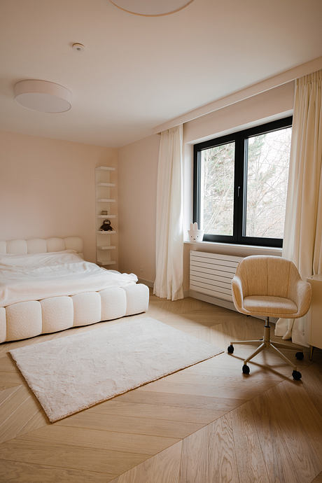 Pigwy Residence Shapes a Quiet Domestic Mood Through Marble and Oak - 8