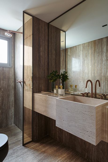 Cerâmica Apartment Shapes Calm Interiors Through Warm Stone and Wood - 13