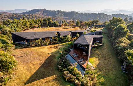Casa Mavra Turns Two Angular Volumes into a Black Concrete House