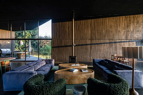 Casa Mavra Turns Two Angular Volumes into a Black Concrete House - 3