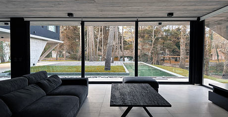 Origami House Folds Concrete Into Triangles Amid Coastal Pines - 3