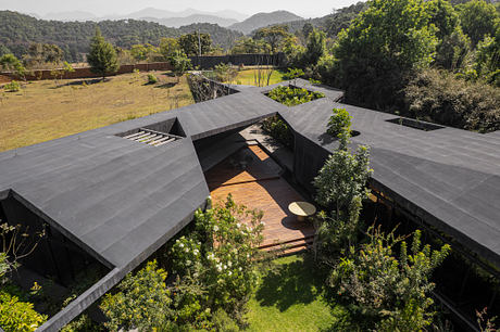 Casa Mavra Turns Two Angular Volumes into a Black Concrete House - 8