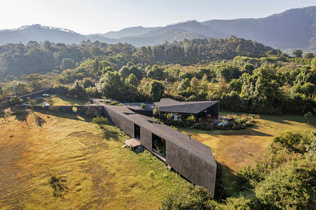 Casa Mavra Turns Two Angular Volumes into a Black Concrete House - 9