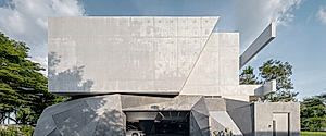 Cavern House Opens With a Cave-Like Garage Below
