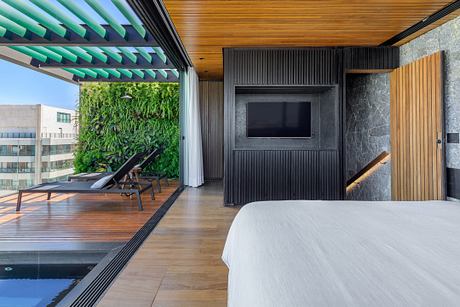 Arpoador Triplex Extends the Living Room to the Balcony | HomeAdore