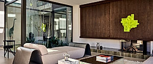 PR 27 Sets a Black Facade Against Warm Rooms