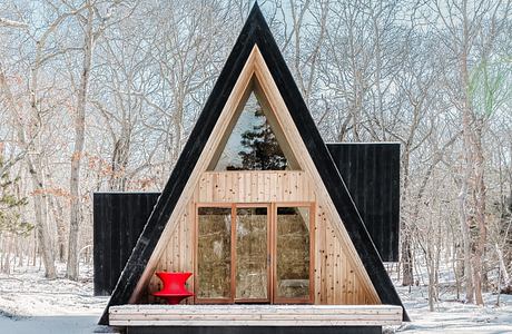 Woods Retreat Sets a Charred A-Frame in the Trees